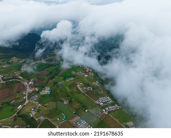 top view aerial shot of village and road mountain above the cloud at Phu tub berk , Phetchabun province , Thailand - Shutterstock ID 2191678635
