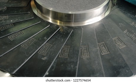 Top Of View Of Airport Baggage Claim With Luggage Spinning Around Conveyor