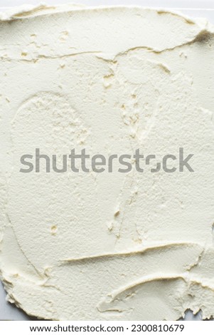 Top view of american buttercream spread out, buttercream with air pockets, textured buttercream