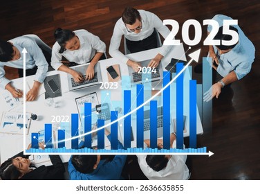 Top view analyst team utilizing BI Fintech to analyze financial data at table in meeting room. Analytic BI dashboard power on paper for business insight and strategic marketing planning. Prudent Amity - Powered by Shutterstock - Get 15% off with code: PIKWIZARD15