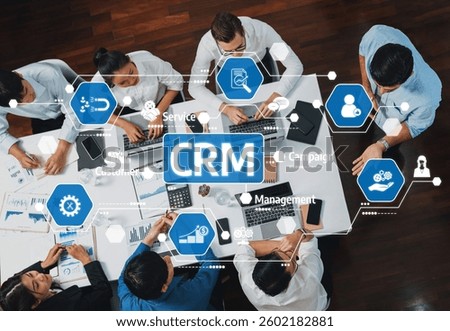 Top view analyst team utilizing BI Fintech to analyze financial data at table in meeting room. Analytic BI dashboard power on paper for business insight and strategic marketing planning. Prudent Amity
