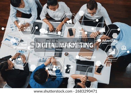 Top view analyst team utilizing BI Fintech to analyze financial data at table in meeting room. Analytic BI dashboard power on paper for business insight and strategic marketing planning. Prudent Amity