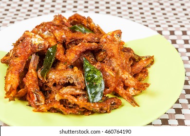 Top View Of Anchovies Fish Fry In A Plate . This Fish Is Also Know As Netholi, Nethili & Kozhuva In South India Which Is Spicy Seafood.