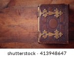 top view of antique book cover, with brass clasps. vintage filtered and toned
