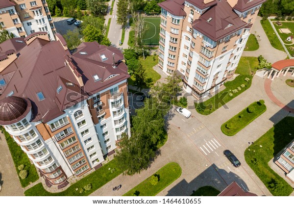 Top view of\
apartment or office tall buildings, parked cars, urban city\
landscape. Drone aerial\
photography.