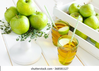 Top View Of Apple Juice. Apples In A Wooden Box