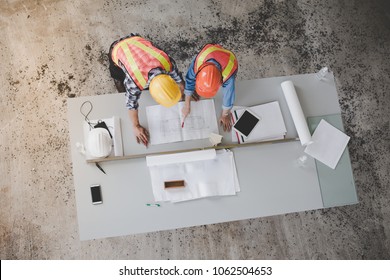 Top View Of Architects And Engineers To Help Create A Blueprint To Build A Modern Building Equipped With The Skills To Fix Errors And Make Suggestions During Construction.