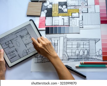 Top View Of Architects & Interior Designers Hands Working On Table With Tablet And Illustration/ Home Renovation Concept