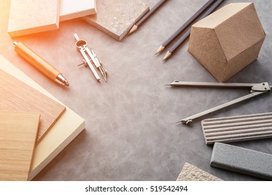 Top View Of Architects Table With Stuff Of Modern House With Material Sample On Creative Desk With Free Copyspace