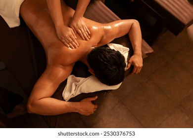 Top view, Aromatherapy massage, Relaxation man customer get service aromatherapy massage with professional masseuse in spa salon. - Powered by Shutterstock