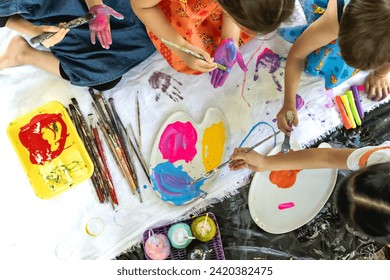 Top view artist kids painting together in art class - Powered by Shutterstock