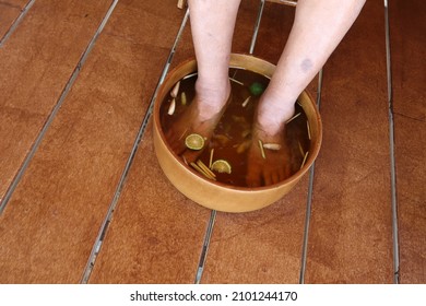 Top View Asian Female Legs Foot Bath In Warm Water Herbal Holder For Health, Foot Spa Treatment