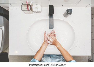 Top view Asian woman hand washing with faucet water in Bathroom at home, Health care of Covid-19 pandemic, cleaning and carefree concept