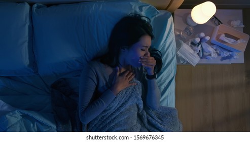 Top View Of Asian Woman Has Illness From Colds Or Flu And Sore Throat On Bed At Night