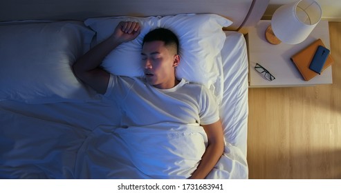 Top View Of Asian Young Man Snores When He Sleep At Night