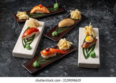 Top view of assorted mixed Japanese sushi set with rolls, nigiri, soy sauce, ginger. Mixed Sushi Set nigiri.
