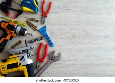 Top view of assorted woodwork and carpentry or construction tools with the place for inscription