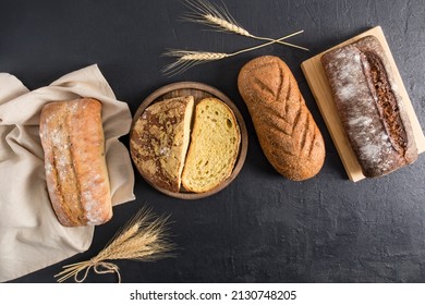 top view of the assortment of delicious baked bread of various shapes from flour of different varieties. a copy of the space. - Shutterstock ID 2130748205