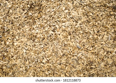 Top View Background Texture Of Light Colour Wooden Chips/playground Mulch Covered The Ground.