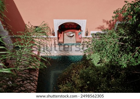 Top view of backyard in moroccan riad with small swimming pool