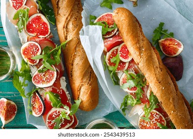 Top view baguette sandwich filled with fresh figs, arugula and prosciutto - Powered by Shutterstock