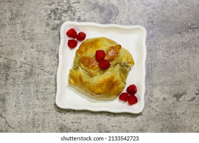 Top View Of A Baked Brie Wrapped In  Puff Pastry.