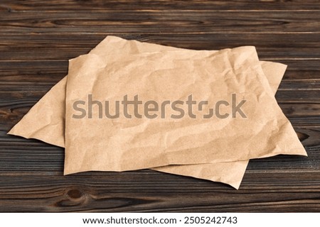 top view with baking parchment empty on table background. Folded cloth for mockup with copy space, Flat lay. Minimal style.