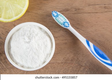 Top View Of Baking Soda With Toothbrush And Lemon