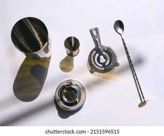 A Top View Of Barware For Making Cocktails On A White Background