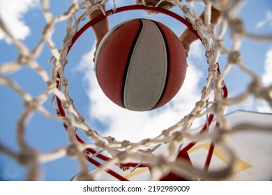 Top View Basketball Kids Training Game. View Of Flying Ball To Basket From Top, Kid Play Basketball.