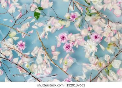 Top View Of Bath Filled With Blue Bubble Water, Flowers And Petals, Spa Or Selfcare Concept