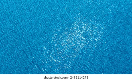 Top view beach sand background for summer vacation concept. Beach nature and summer seawater with sunlight light sandy beach Sparkling sea water  - Powered by Shutterstock