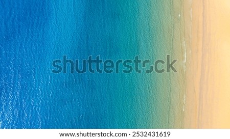 Top view of beach sand background for summer vacation concept. Beach nature and summer seawater with sunlight light sandy beach Sparkling sea water 