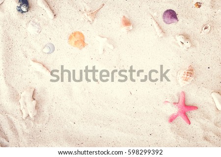 Top view of Beach sand with shells and starfish. summer background concept. vintage tone.