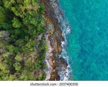 The top view of beautiful blue seashore and rocky on coast, drone view