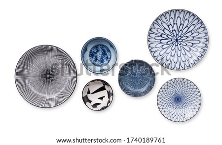 Top view of beautiful crockery set with porcelain ceramic plate round dish and cup bowl isolated on white background.