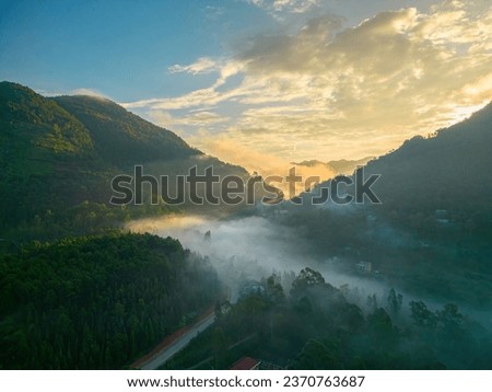 Top view beautiful morning with fog in Dong Van (Ha Giang) Vietnam - UNESCO Geopark. the majestic moutain ranges and long pass in vietnam with magical of the light and sky and fog at sunrise