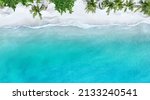 Top view of beautiful tropical beach which summer  Amazing Sandy coastline and white turquiose sea waves. As Aerial view of white sand beach and water surface texture, foamy waves