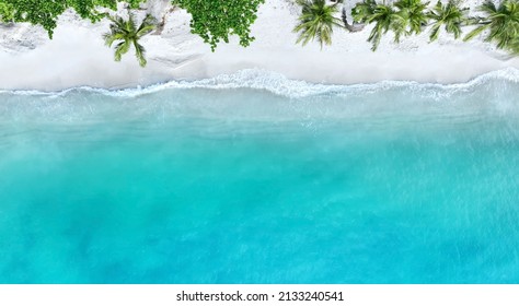 Top view of beautiful tropical beach which summer  Amazing Sandy coastline and white turquiose sea waves. As Aerial view of white sand beach and water surface texture, foamy waves - Powered by Shutterstock