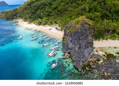 Top view of beautiful turquoise beach, with white sand. Best beaches of Philippines. Seven Commandos beach, Palawan