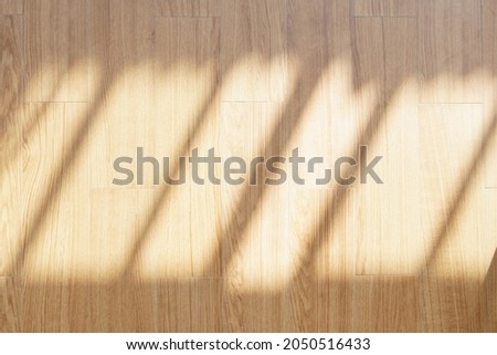 Top view of a beautiful wooden oek wood floor with morning sunlight and shadow. Abstract, Brown, Warm, Background, Backdrop, Mock up, Eco living, Texture, Surface, Natural.