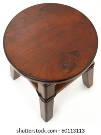 Top View Beautiful Wooden Stool With Leather And Rivet Supports Over White Background.