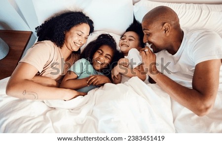 Top view, bed and family with love, relax and quality time with happiness, wellness and bonding. Parents, mother and father with children, kids and cheerful in a bedroom, funny and laughing together