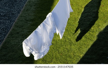 top view of bedsheets drying outside