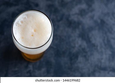 Top View Of Beer Glass With Foam Cap And Copyspace