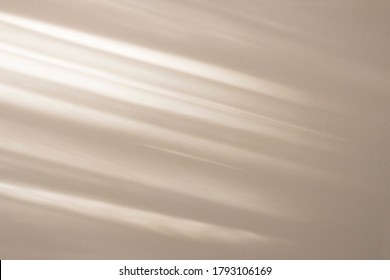 Top view of beige light bokeh shadow on sand color background. Flat lay with shadow on the wall. Minimal summer concept. Creative copyspace for overlay on product presentation, backdrop and mockup.