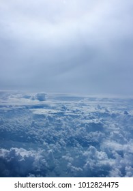 Top view of big and fluffy cloud in the blue sky