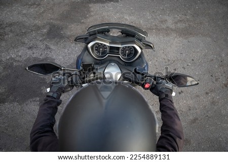Top view of a biker riding his motorcycle, photo with copy space