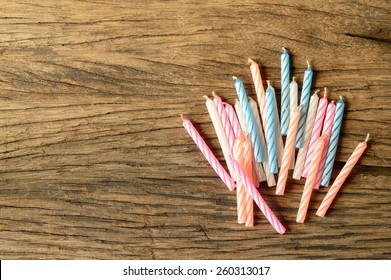 Top View Of Birthday Candle On Old Wooden Table