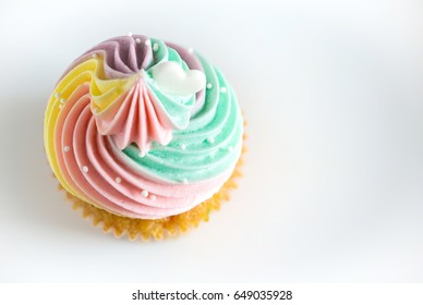 Top View Birthday Cupcake On White Background.mini Cake. Cupcake With Rainbow Cream And Heart For Love Valentines.image For Background,wallpaper And Copy Space.